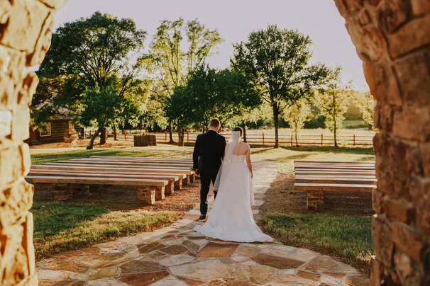 Couple walking in the Ceremony Grove